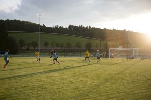 Boys at football training on the sports field in front of Schloss Salem